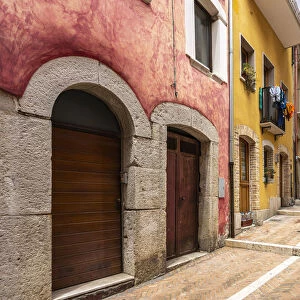 Alleys in the historic center of Campobasso with colored facades and brick paving