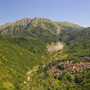 The Alto Mountain and little town of Sassalbo insummer day, municipality of Fivizzano