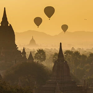 Ancient temple city of Bagan (Pagan) & balloons at sunrise, Myanmar (Burma)