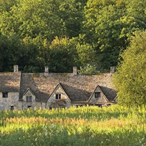 Arlington Row cottages in the Cotswold village of Bibury, Gloucestershire, England