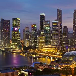 Asia, Singapore, Singapore Skyline Financial district illuminated at dusk