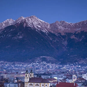 Austria, Tyrol, Innsbruck, elevated view of the Wilten Basilica, dawn, winter