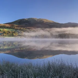 Autumnal reflections on a frosty morning at Loweswater in the Lake District National Park