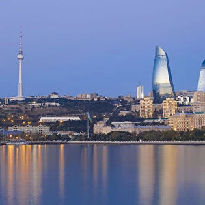 Azerbaijan, Baku, View of the Flame Towers reflecting in the Caspian Sea