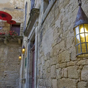 A balcony and lantern in Sarlat France