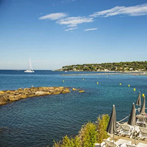 Beach in Antibes (Cap Antibes in background), Alpes-Maritimes, Provence-Alpes-Cote