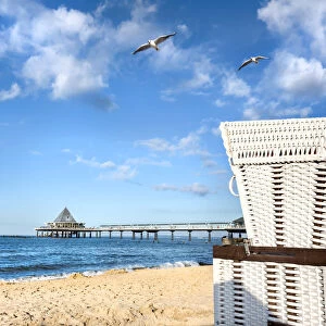 Beach basket and pier, Heringsdorf, Usedom island, Mecklenburg-Western Pomerania, Germany
