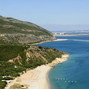 The beautiful beach of Portinho niched in the Arrabida mountains. Setubal, Portugal