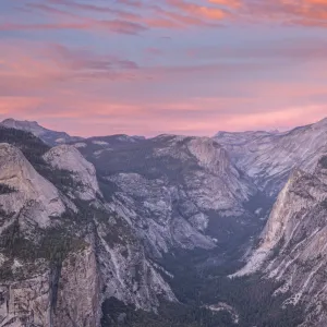 Beautiful pink sunset above Half Dome and Yosemite Valley, viewed from Glacier Point