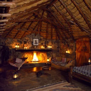 Bedroom at Sabuk, lit by lanterns & candles at night