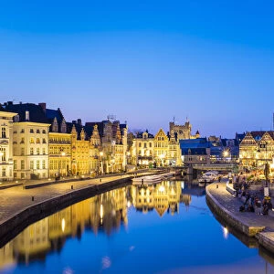 Belgium, Flanders, Ghent (Gent). Buildings along the Leie River and Graslei quay at dusk