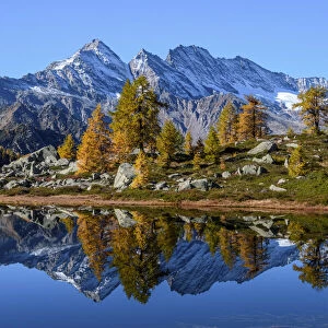 Bellagarda lake in autumn with Levanne on background (Orco valley, Gran Paradiso National Park, Piedmont, Italy, Italian alps)