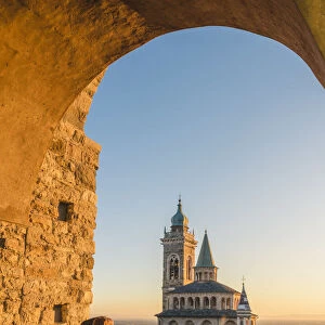 Bergamo, Lombardy, Italy. Tourist photographing the Saint Mary Major (Santa Maria