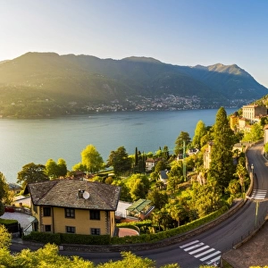 Blevio, lake Como, Como province, Lombardy, Italy. The winding coastal road at sunset