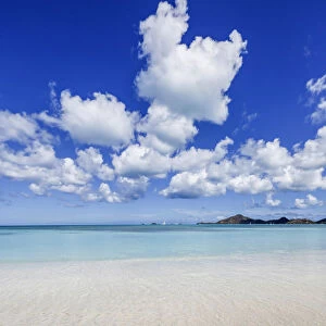 Blue sky frames the white sand and the turquoise Caribbean sea Ffryers Beach Antigua