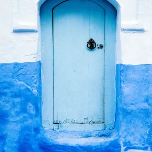 Blue-washed doors and streets of Chefchaouen, Morocco