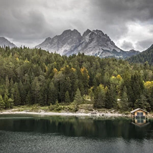 Boathouse on Lake Blindsee with Zugspitze massif, Biberwier, Tyrol, Austria