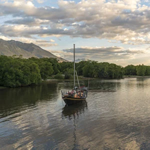 Boats on Lake Wakatipu at sunset. Glenorchy, Queenstown Lakes district, Otago region