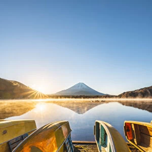 Boats moored at lake Shoji and Mt. Fuji, Yamanashi Prefecture, Japan