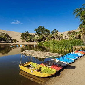 Boats on the shore of the Huacachina Lake, Ica Region, Peru