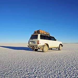Bolivia, Potosi Department, Daniel Campos Province, White Toyota Landcruiser on the Salar de Uyuni