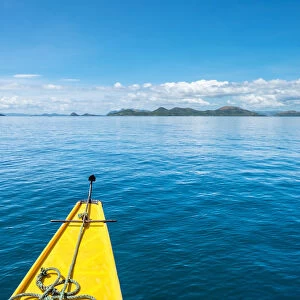 Bow of an outrigger boat on blue water in Hidden Lagoon, Coron Island, Palawan