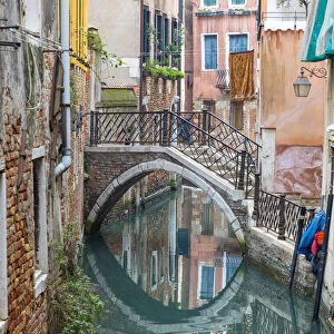A bridge crosses a small canal, Castello, Venice; veneto; Italy
