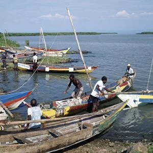Brightly painted fishing boats of the Luo people find