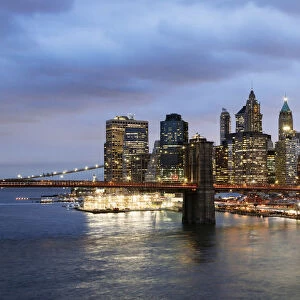 Brooklyn bridge and lower Manhattan skyline at dusk, New York, USA