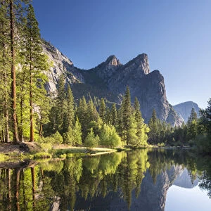 The Three Brothers reflecting in the River Merced in Yosemite Valley, California, USA