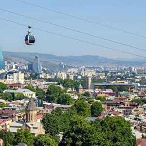 Cable car between Rike Park and the Narikala fortress passes above buildings in central