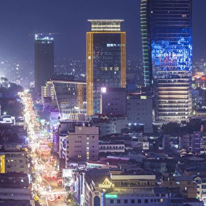 Cambodia, Phnom Penh, elevated city skyline along Monivong Boulevard, dusk
