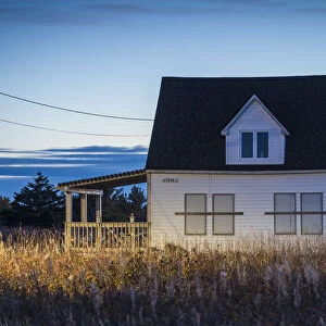Canada, New Brunswick, Acadian Peninsula, Miscou Island, old house, dusk