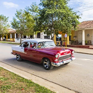 A car driving in a street in Vinales, Pinar del Rio Province, Cuba