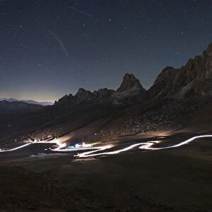 Car trail at night on the Giau Pass, Dolomites, Italy