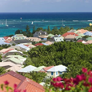 Caribbean, French West Indies, Saint Martin, colourful buildings at Orient Beach