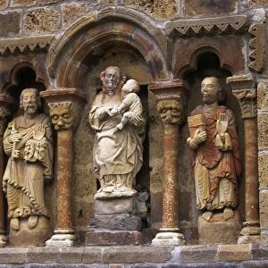 Detail of carved stone figures on the XIIth C Romanesque