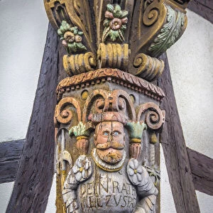 Carving on half-timbered house in the old town of Kronberg, Taunus, Hesse, Germany