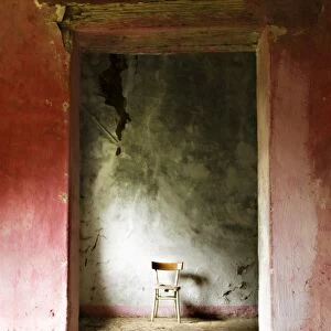 Chair in a deserted farm near San Quirico d Orcia, Valle de Orcia, Tuscany, Italy