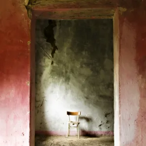 Chair in a deserted farm near San Quirico d Orcia, Valle de Orcia, Tuscany, Italy