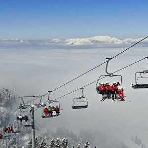 Chair lift carries skiers to the slopes on the Hohe Salve, Hopfgarten, Tyrol, Austria