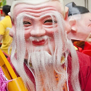 China, Hong Kong, Tai Kok Tsui Temple Fair, Parade Participant Dressed in Lucky God