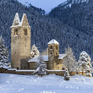 Church of San Gian surrounded by snowy woods, Celerina, Engadine, canton of Graubunden