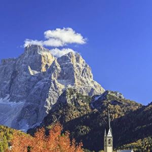 Church of Selva of Cadore with Mount Pelmo in the background in autumn. Dolomites