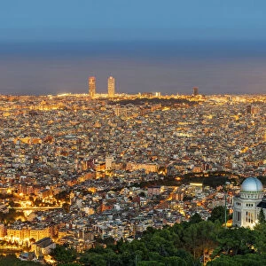 City skyline with Fabra astronomical observatory at twilight, Barcelona, Catalonia, Spain