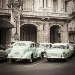 Classic American Cars in front of the Gran Teatro, Parque Central, Havana, Cuba Classic American Cars in front of the Gran Teatro, Parque Central, Havana, Cuba