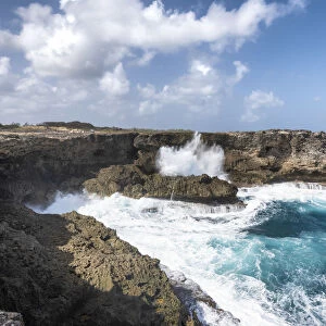 The cliff in front of the big waves of Atlantic Ocean, North Point, Barbados Island