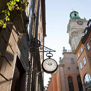 Clock outside shop & The clocktower of Storkyrkan (The Great Church), Gamla Stan