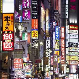 Colorful neon signs at the Kabukicho red light district, Shinjuku, Tokyo, Japan