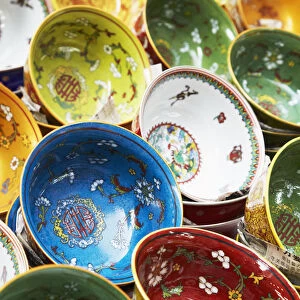 Colourful Chinese bowls on market stall on Upper Lascar Row (Cat Street), Central